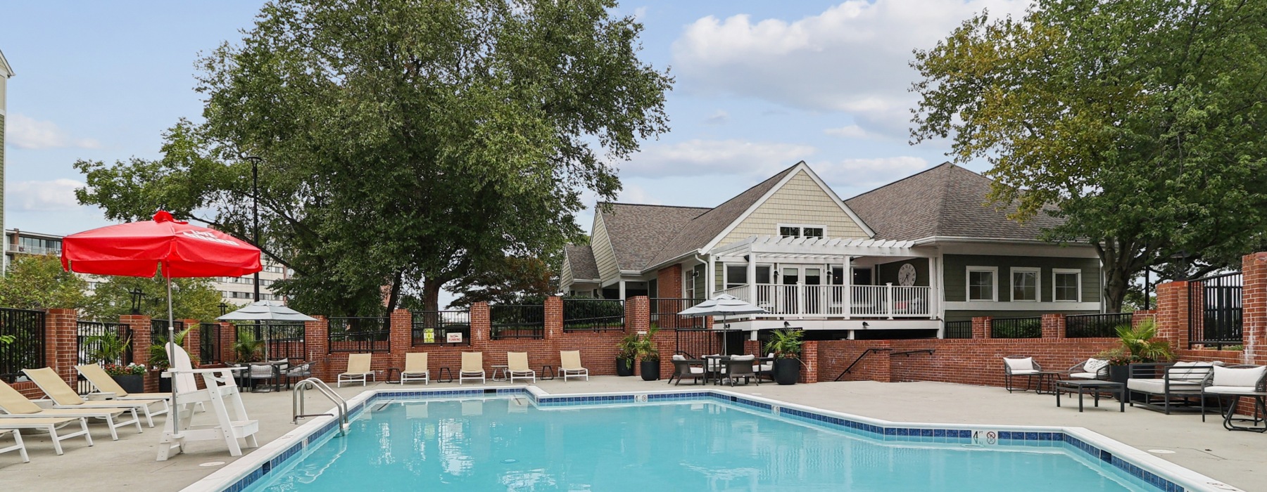 Pool with expansive sundeck and pool chairs